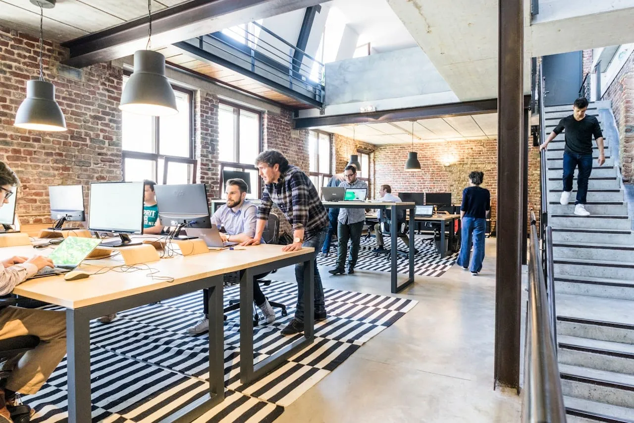A technology team collaborating in a bright open-plan office
